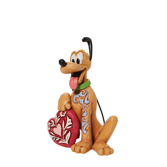 Mickey and Minnie Mouse's pet dog, Pluto the pup, holds a rosemaled heart under his yellow paw in this lively Jim Shore figurine from Disney Traditions. With one ear raised inquisitively, Pluto wears a giddy expression in this delightful miniature.