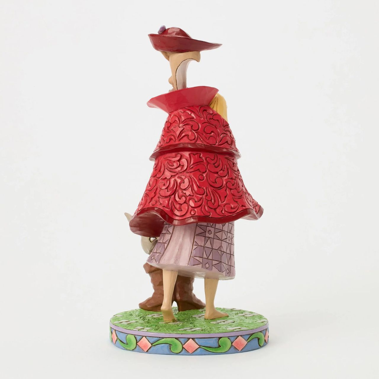 Aurora's forest friends transform into a man in a red coat as she searches for her prince. An owl, squirrel, and bunnies inside boots add charm to this captivating Jim Shore design, bringing the memorable movie scene to life with enchantment.