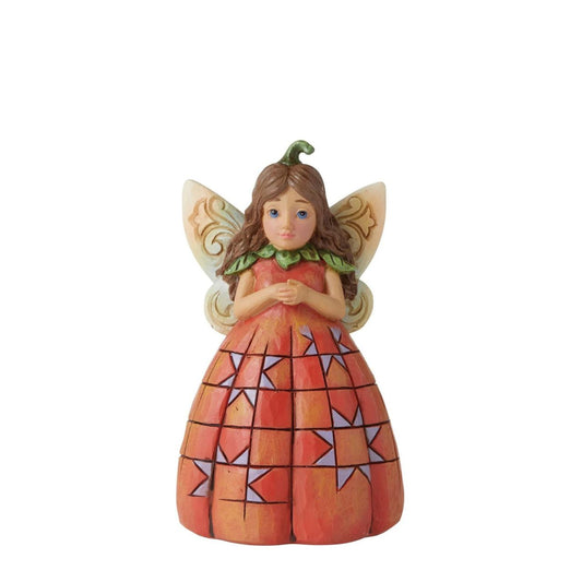 Heartwood Creek Pumpkin Fairy Figurine  Handcrafted in breath-taking detail, this beautiful Pumpkin Fairy Mini Figurine is beautifully decorated in Jim Shore's subtle combination of traditional quilt. Hands clasped delicately, the pumpkin fairy smiles softly, wings spread wide.