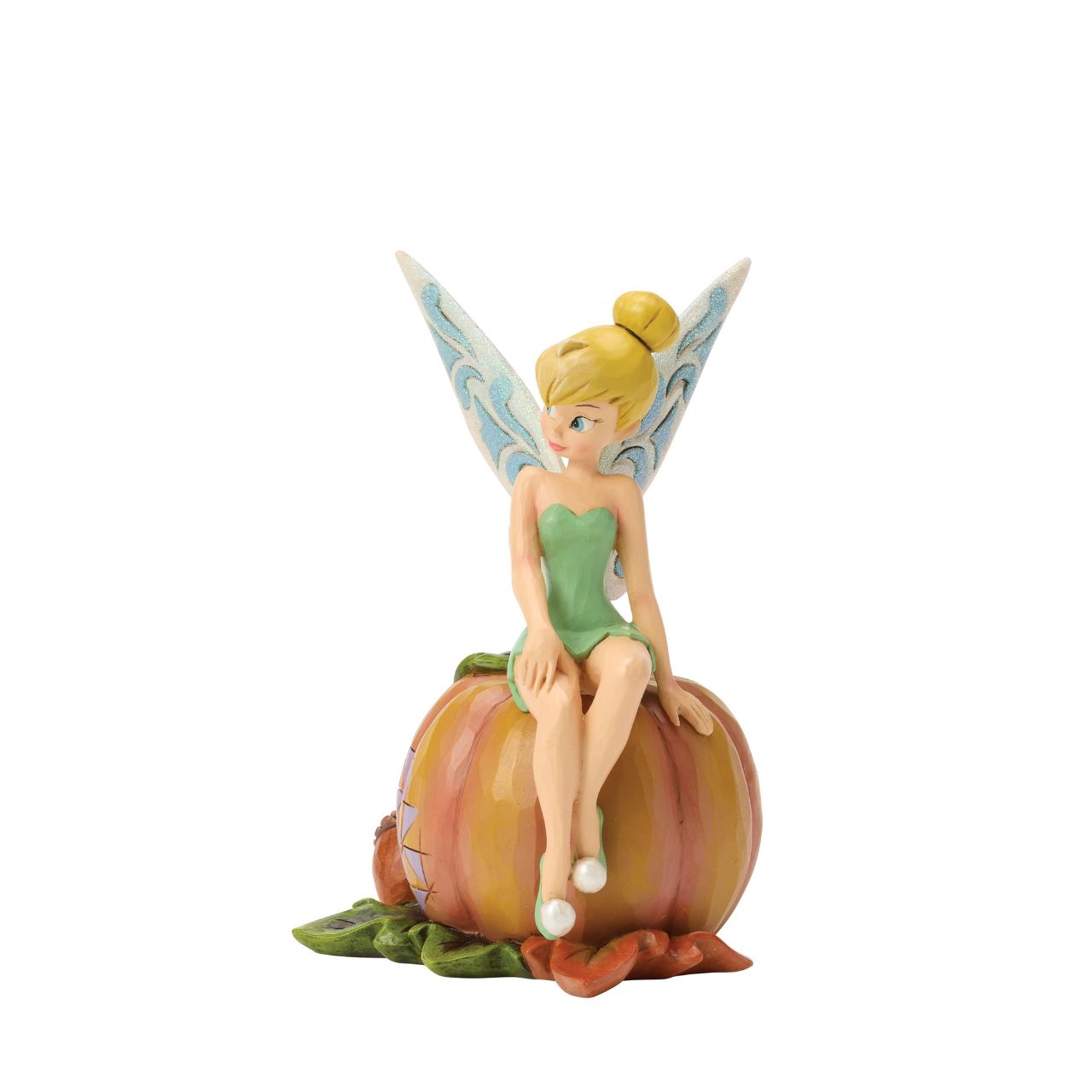 Tinker Bell adds a touch of pixie dust to Halloween magic in this charming Jim Shore design. Dressed in festive autumn colours, she sits gracefully on a pumpkin, blending Disney whimsy with folk-art charm.