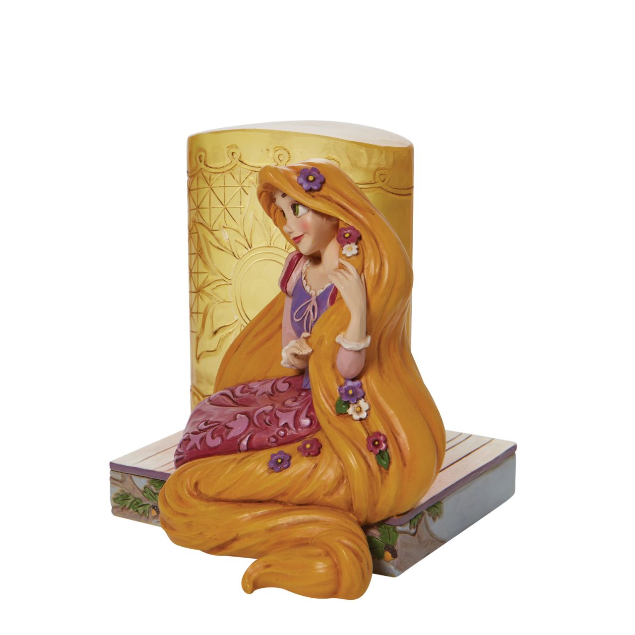 This Disney Traditions line by Jim Shore features iconic Walt Disney princesses with their famous props. With flowers in her long hair, this piece features Rapunzel with her golden locks kneeling next to a large lantern.