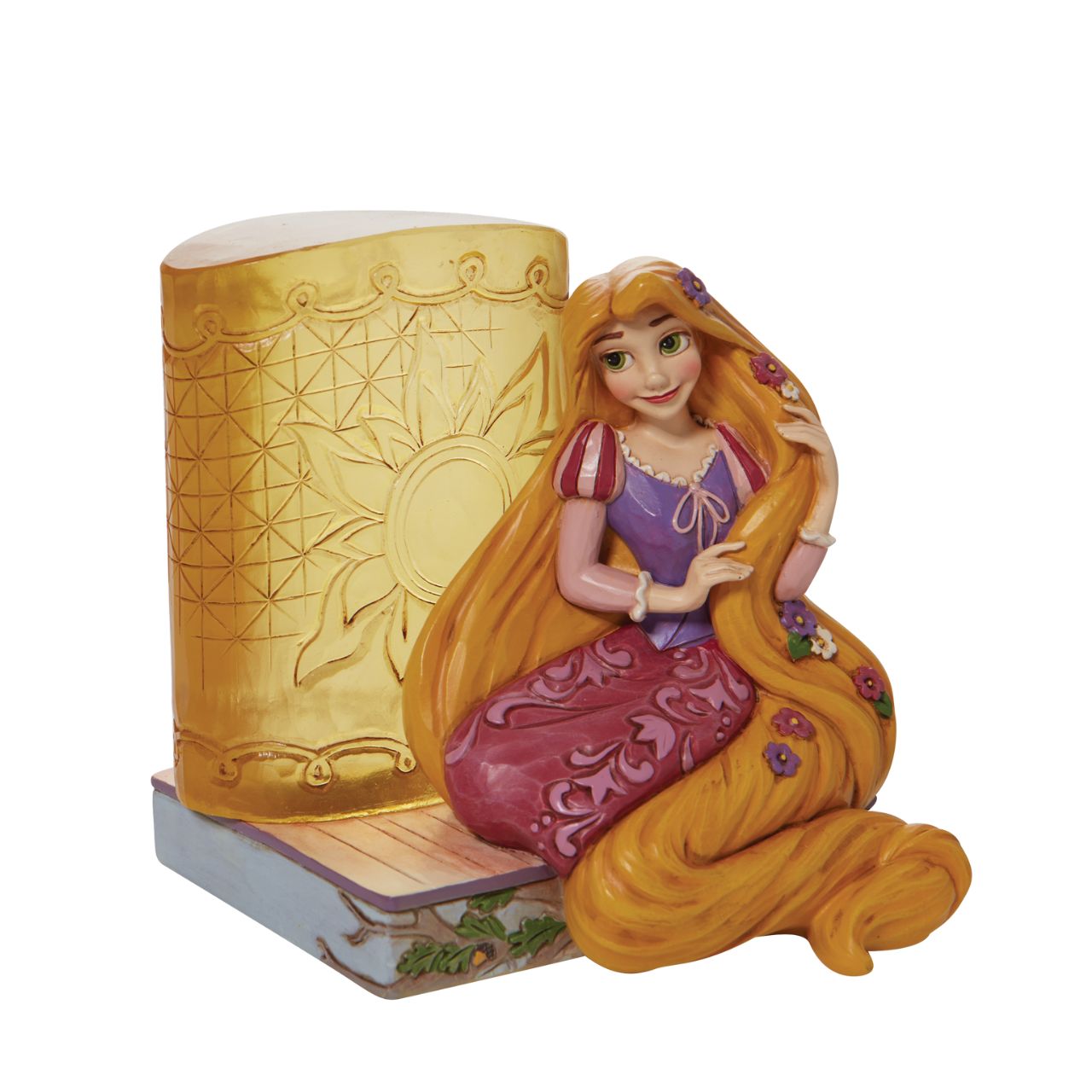 This Disney Traditions line by Jim Shore features iconic Walt Disney princesses with their famous props. With flowers in her long hair, this piece features Rapunzel with her golden locks kneeling next to a large lantern.