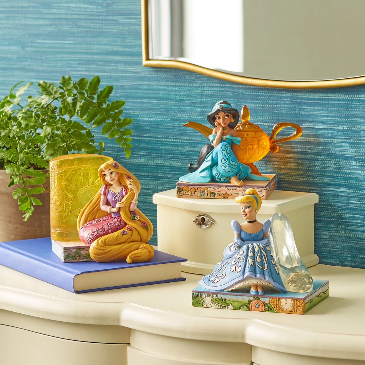 This Disney Traditions line by Jim Shore features iconic Walt Disney princesses with their famous props. With flowers in her long hair, this piece features Rapunzel with her golden locks kneeling next to a large lantern.