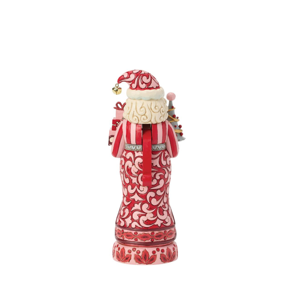 Santa stands tall in pink and crimson coat with snowy trim, his beard curling in carved detail. Folk-art rosemaling swirls across his suit, hand-painted in Jim Shore's warm, festive style.