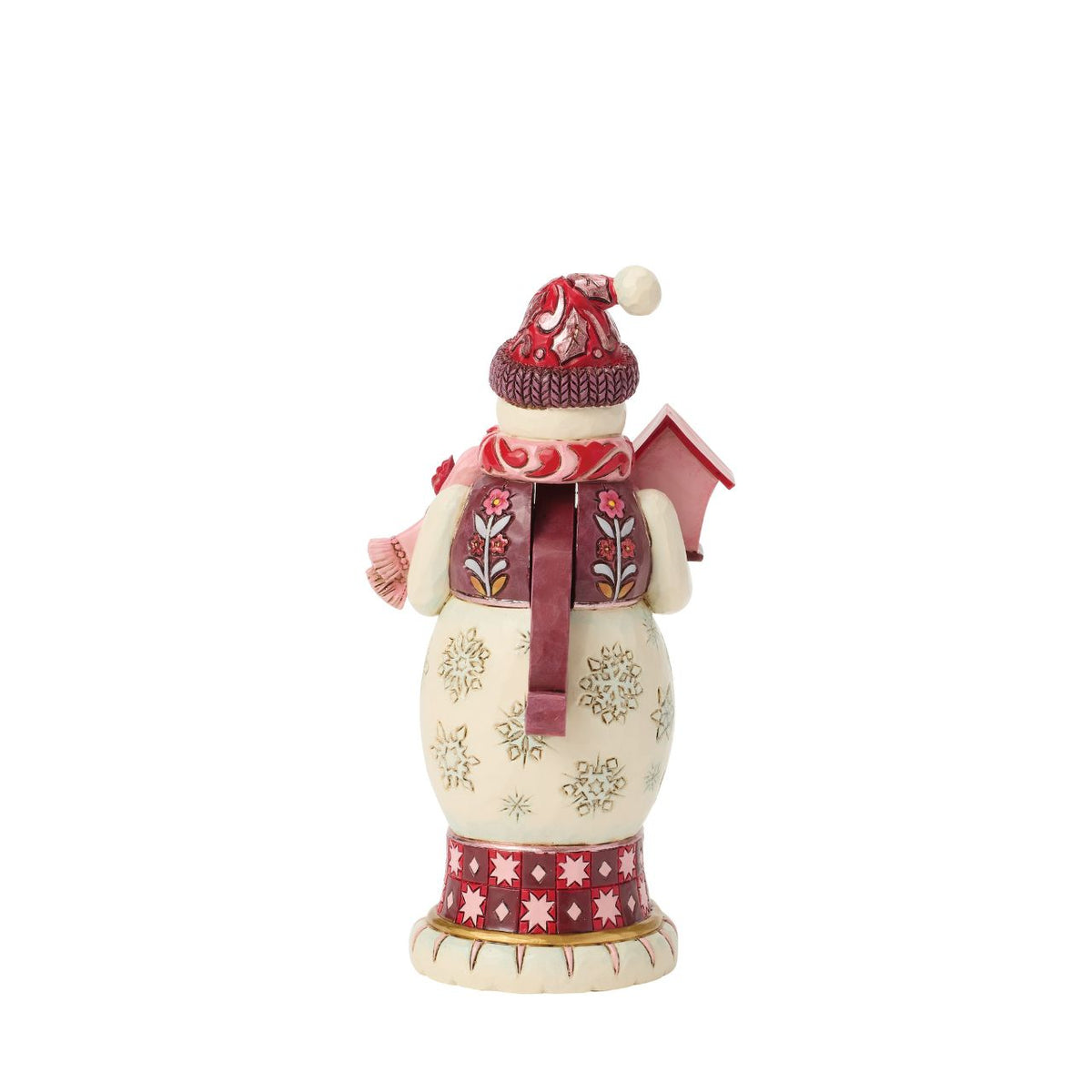 This snowman nutcracker is full of frosty personality, sporting a red top hat, cosy scarf, and cheery smile. Jim Shore's hand-painted folk designs wrap around his coat, adding rich detail and whimsy. A delightful way to bring snowy sparkle indoors.