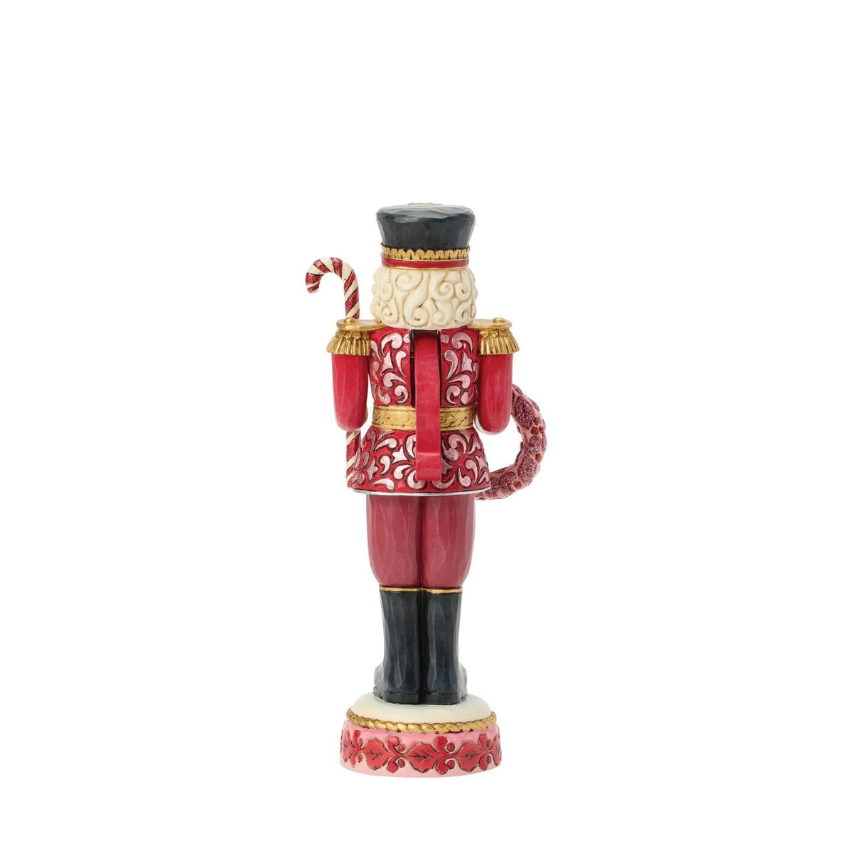 This Toy Soldier nutcracker is smartly dressed in crisp red and white with golden accents. Jim Shore's signature folk-art patterns add warmth and personality to the disciplined stance, making it a playful yet elegant holiday accent.