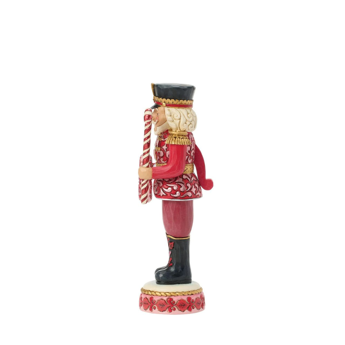 This Toy Soldier nutcracker is smartly dressed in crisp red and white with golden accents. Jim Shore's signature folk-art patterns add warmth and personality to the disciplined stance, making it a playful yet elegant holiday accent.