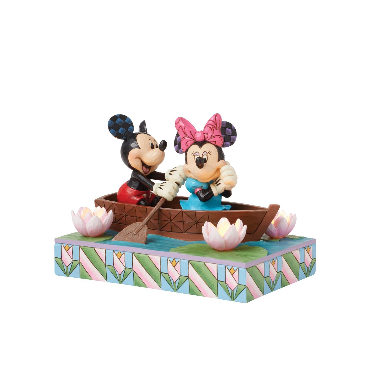 Disneys Mickey and Minnie Mouse are sailing on love in this sweet, light-up figurine from the Disney Traditions by Jim Shore.