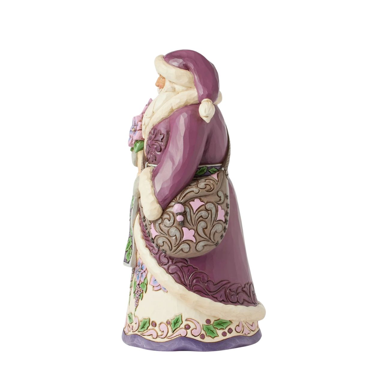 The stunning purple Santa representing Jim Shores trademark colour. Radiating elegance in rich purples, plums, and greens, carrying a vibrant purple poinsettias. His intricately detailed cloak features delicate rosemaling, while his robes bloom with festivities.