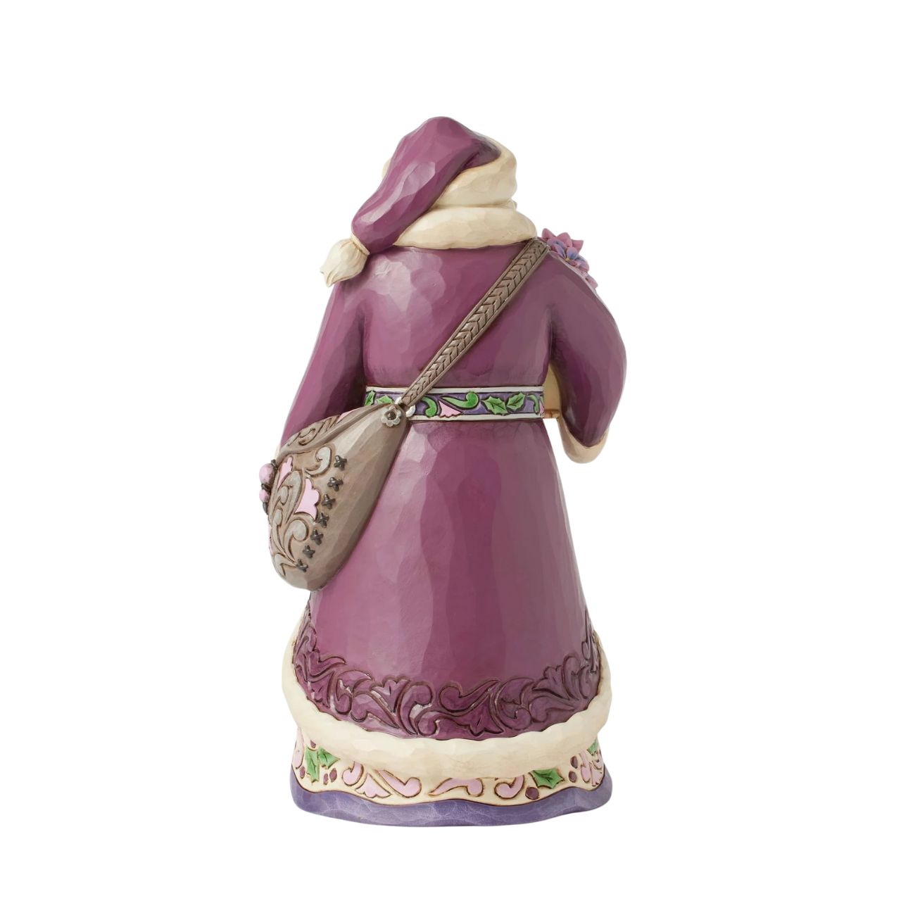 The stunning purple Santa representing Jim Shores trademark colour. Radiating elegance in rich purples, plums, and greens, carrying a vibrant purple poinsettias. His intricately detailed cloak features delicate rosemaling, while his robes bloom with festivities.