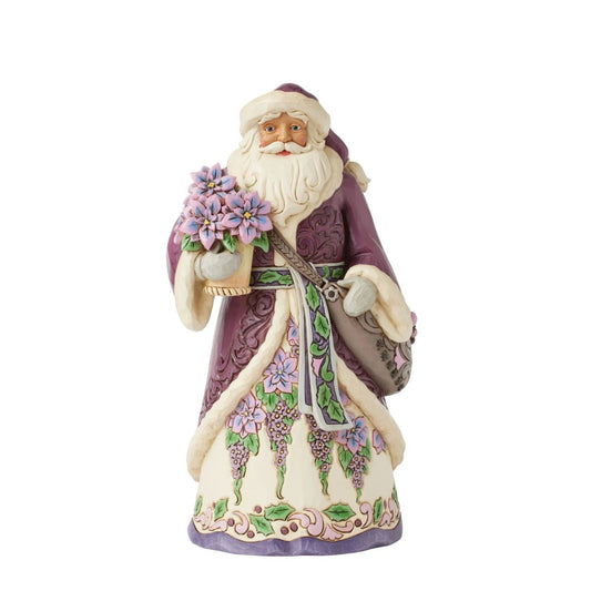 The stunning purple Santa representing Jim Shores trademark colour. Radiating elegance in rich purples, plums, and greens, carrying a vibrant purple poinsettias. His intricately detailed cloak features delicate rosemaling, while his robes bloom with festivities.