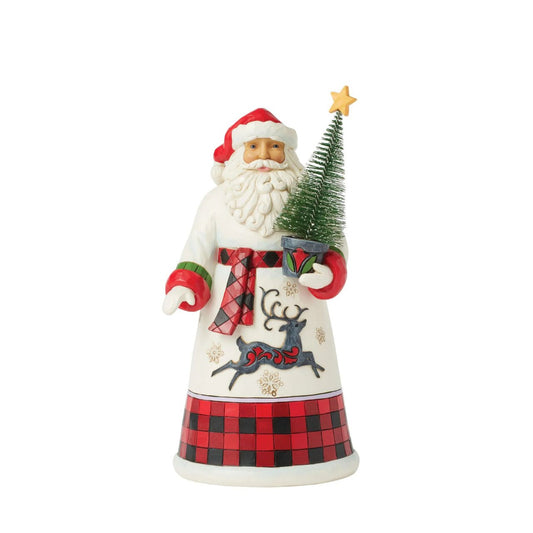 This charming Jim Shore design features Santa holding a decorated sisal tree, dressed in a cosy buffalo plaid cloak that embodies holiday warmth. His gown, adorned with snowflakes and a dashing reindeer silhouette, captures the spirit of the season.