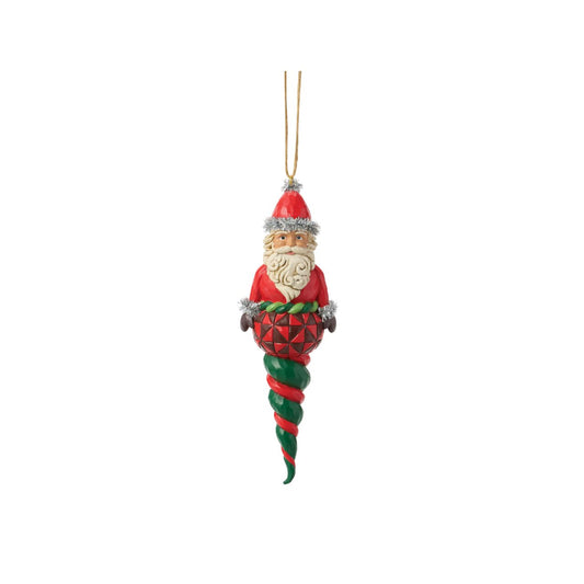 Celebrate the magic of Christmas with the Heartwood Creek Santa Finial by Jim Shore. This meticulously crafted piece captures the warmth and nostalgia of the holiday season, featuring Santa Claus in a classic pose, adorned with Jim Shore's distinctive blend of quilt patterns and folk-art patterns.
