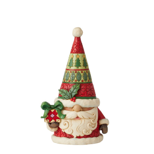 Santa Gnome Figurine by Jim Shore  "Gnomebody loves Christmas as much as Jim Shore" Gnomes have fast become a collectors favourite for Jim Shore and this collection, won't disappoint. This Santa Gnome has a holly on his hat carrying a Jim Shore designed present.