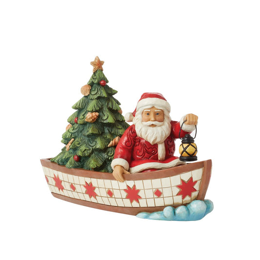 Santa Claus delivers to everywhere in the world. Sometimes he uses other means of transportation than his reindeer sleigh. For coastal deliveries, Santa utilizes a gorgeous red and white boat complete with shell adorned tree and guiding lantern.