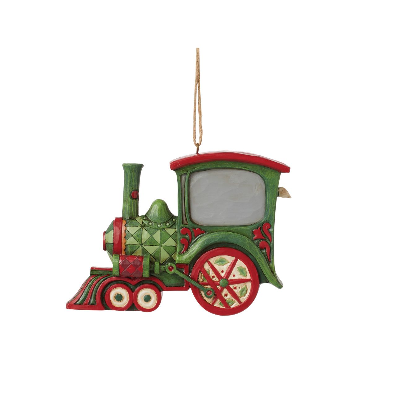 All aboard the Christmas train, next stop, holiday memories! Santa steers this fantastic red and green rosemaling locomotive with mistletoe powered wheels. Hang this stylish train in your tree and admire the creative craftsmanship of Jim Shore.