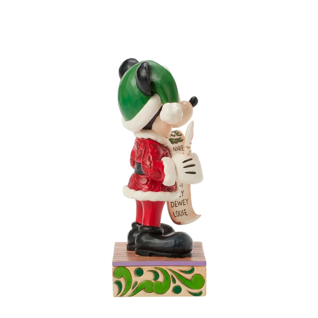 In this enchanting Jim Shore Christmas scene, Mickey Mouse dons a striking red rosemaling suit accented with a green jewelled belt and a Santa hat trimmed with holly. He holds a quill and a list of Naughty and Nice Disney characters with a smile.