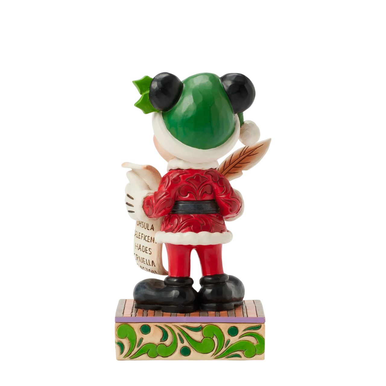 In this enchanting Jim Shore Christmas scene, Mickey Mouse dons a striking red rosemaling suit accented with a green jewelled belt and a Santa hat trimmed with holly. He holds a quill and a list of Naughty and Nice Disney characters with a smile.