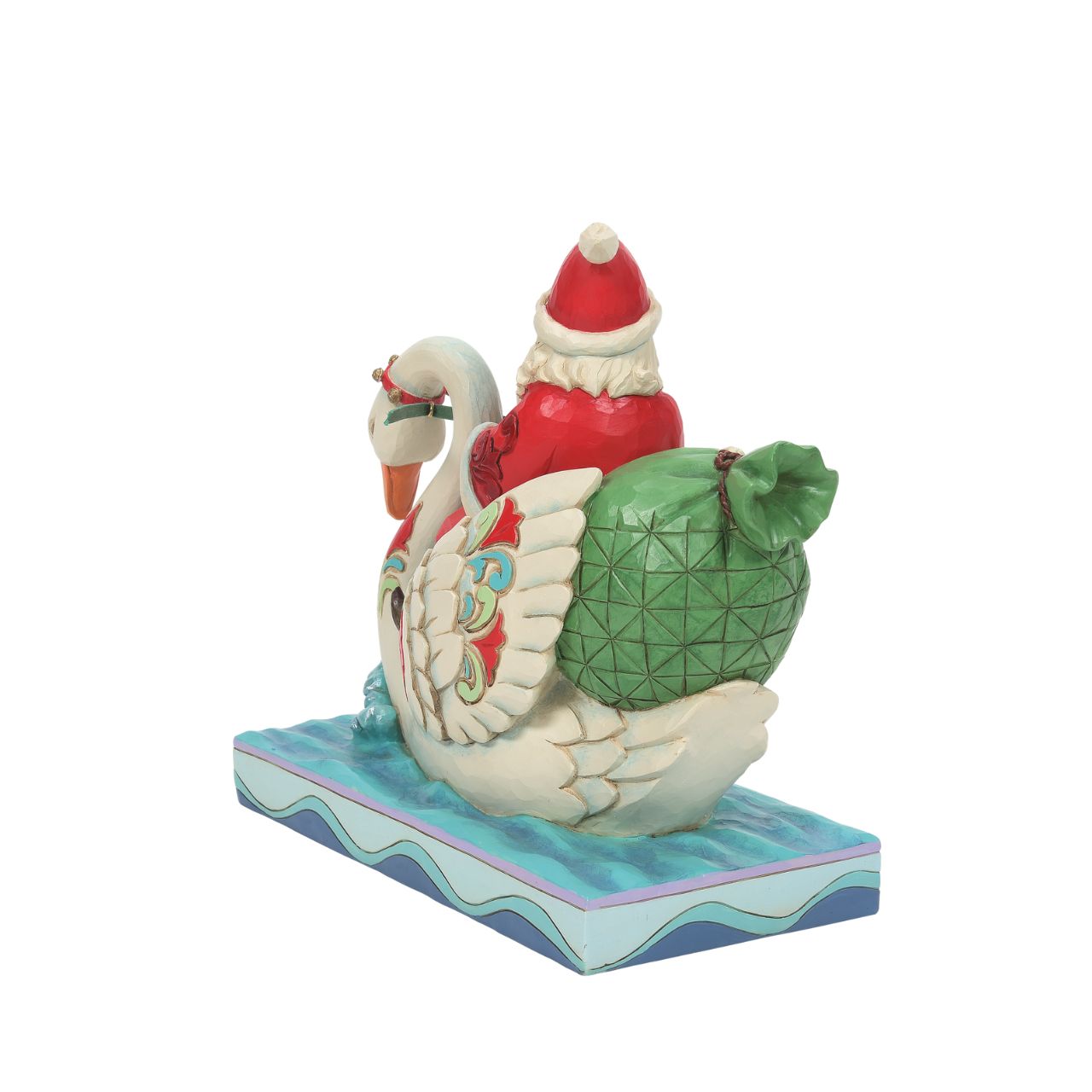 Heartwood Creek Santa Riding a Swan Figurine "Grace and Goodwill"  Steering a stately swan through the water, Santa gives his reindeer led sleigh a break as he makes deliveries riverside. The 7" Jim Shore piece is lively with colour and Christmas creativity. Floating to a town near you, Santa brings grace on wings.