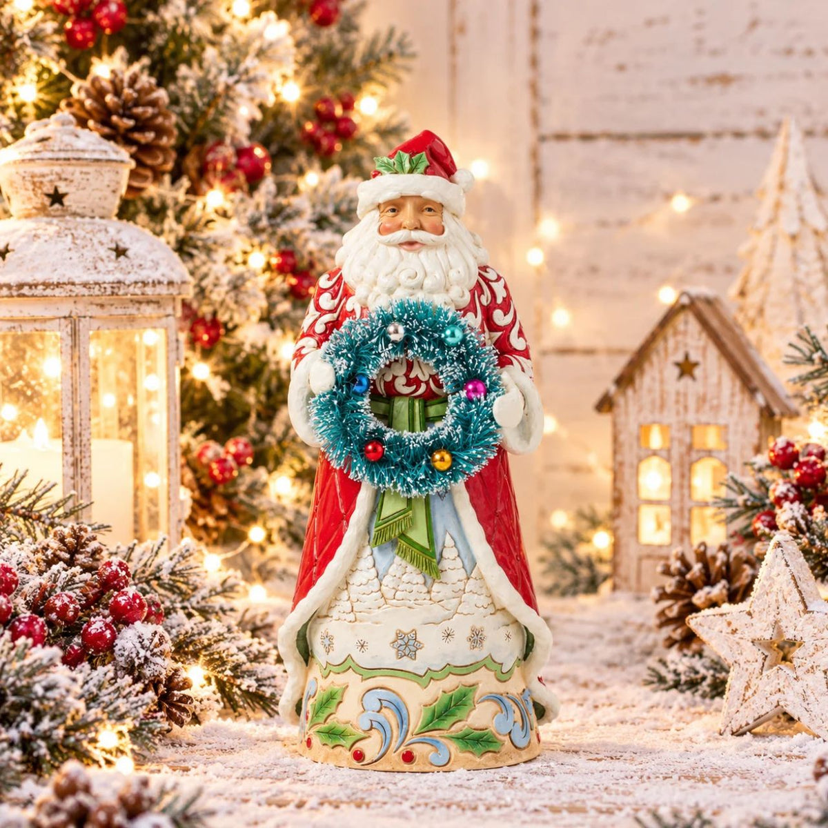 A hand painted Santa figurine by Jim Shore as part of his Heartwood Creek collection, featuring a sisal wreath to add extra fun and texture to the piece. Perfect to add to any Christmas display. Comes in fully branded packaging.