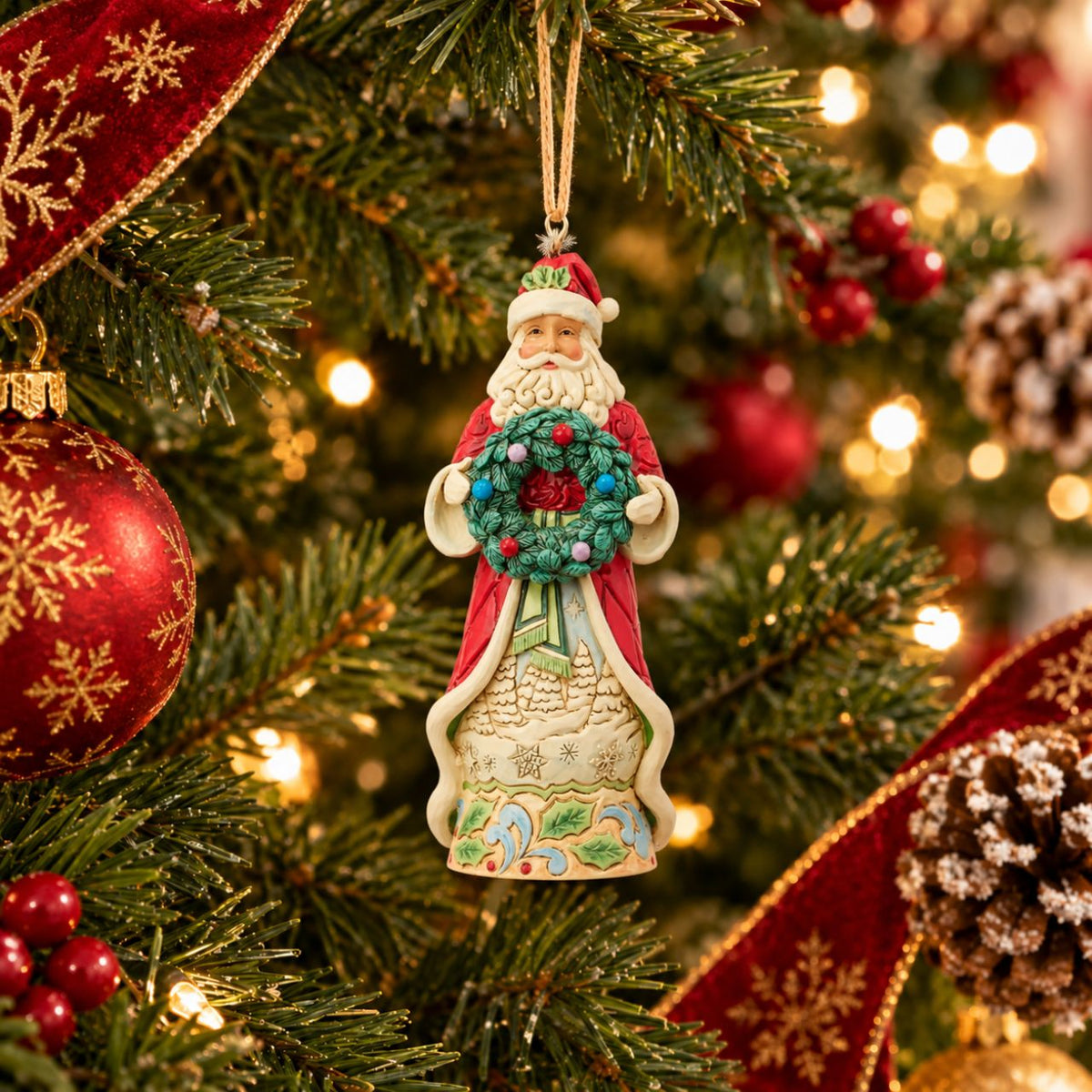 Bring the magic of Christmas to your home with this enchanting Santa figurine from the Heartwood Creek collection by Jim Shore.