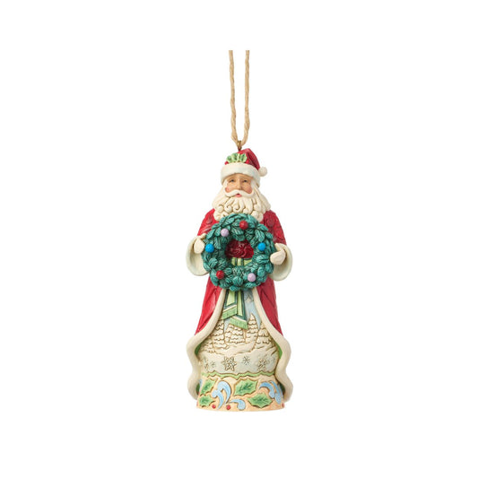 Bring the magic of Christmas to your home with this enchanting Santa figurine from the Heartwood Creek collection by Jim Shore.