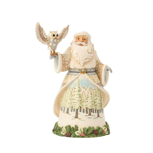 This stunning Jim Shore design features Santa adorned in a gorgeous white cloak trimmed with lush garland, reaching out to a majestic owl.