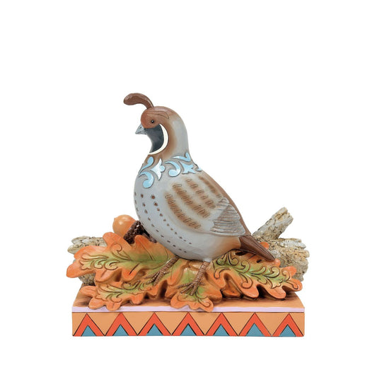 Capture the essence of autumn with this charming Jim Shore figurine of a quail perched on a branch with fall-colored leaves. Delicate blue rosemaling accents the orange leaves and acorns, allowing the piece to radiate with the warmth of the season.