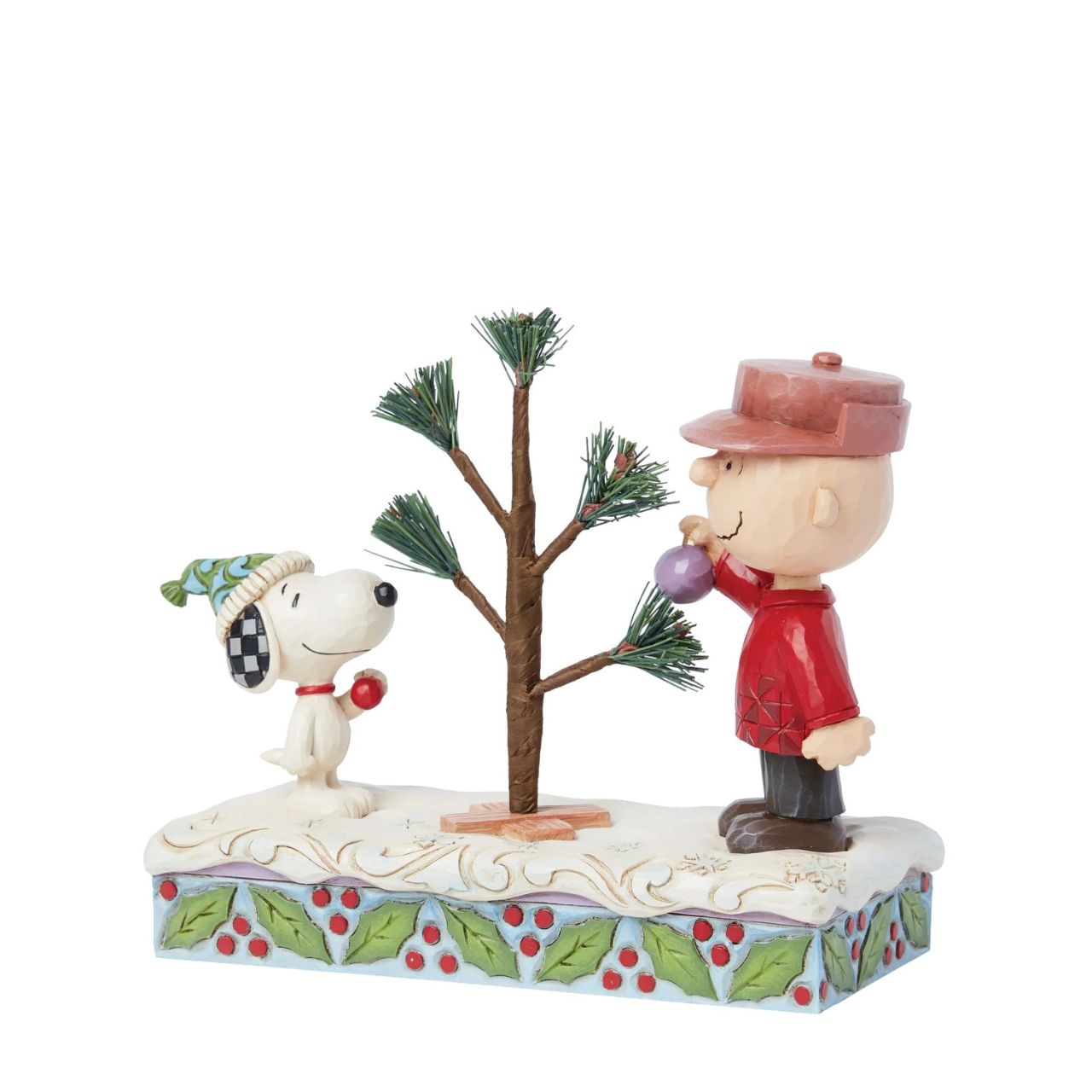 This iconic Jim Shore creation shares a memorable scene from "A Charlie Brown Christmas" special. Charlie picked out a small sampling with hardly any branches, nevertheless, the Peanuts gang came together to decorate it into something wonderful.