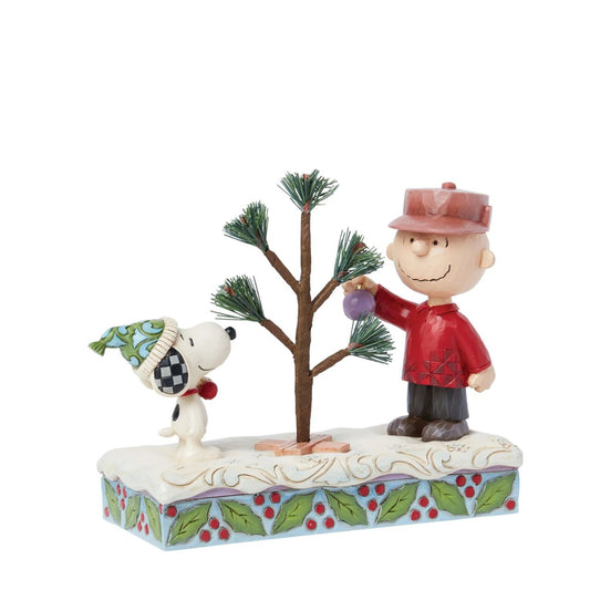 This iconic Jim Shore creation shares a memorable scene from "A Charlie Brown Christmas" special. Charlie picked out a small sampling with hardly any branches, nevertheless, the Peanuts gang came together to decorate it into something wonderful.