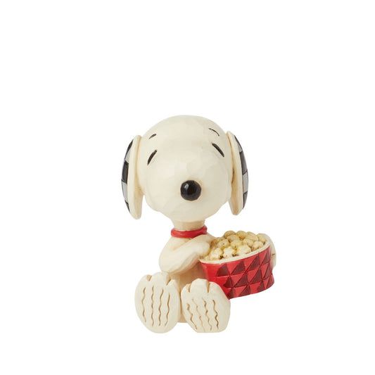 The ever so cheeky Snoopy is having the best time with a large tub of popcorn, ready to watch his favourite film. Mini figurine from the Peanuts collection by Jim Shore. Comes in fully branded packaging.