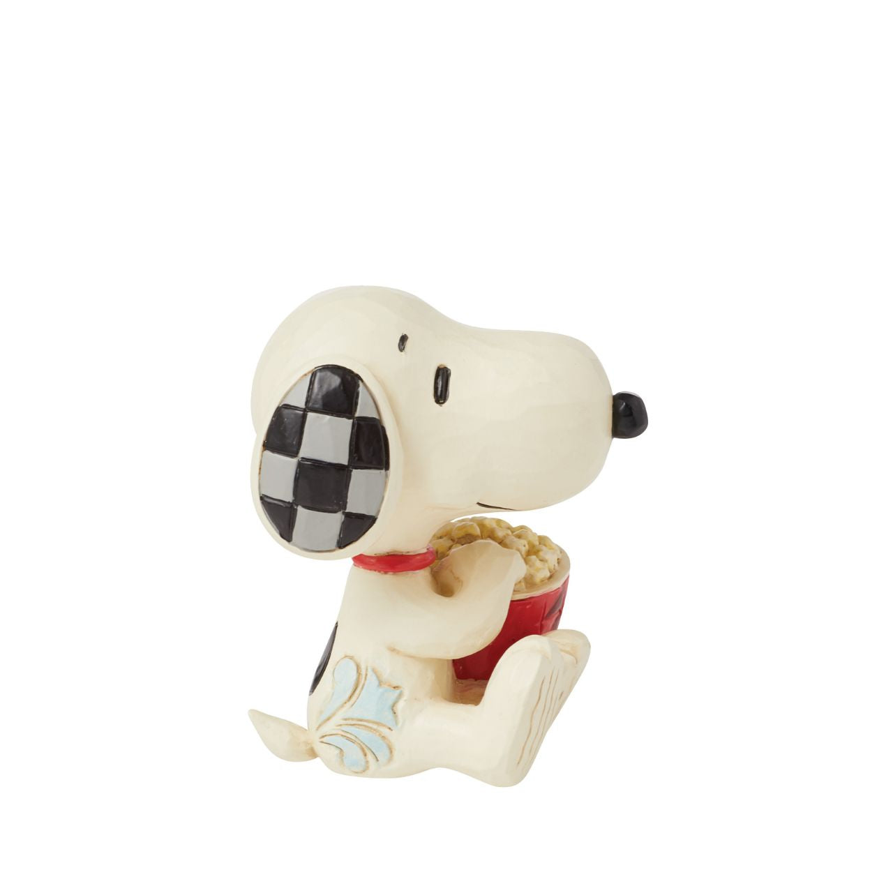 The ever so cheeky Snoopy is having the best time with a large tub of popcorn, ready to watch his favourite film. Mini figurine from the Peanuts collection by Jim Shore. Comes in fully branded packaging.