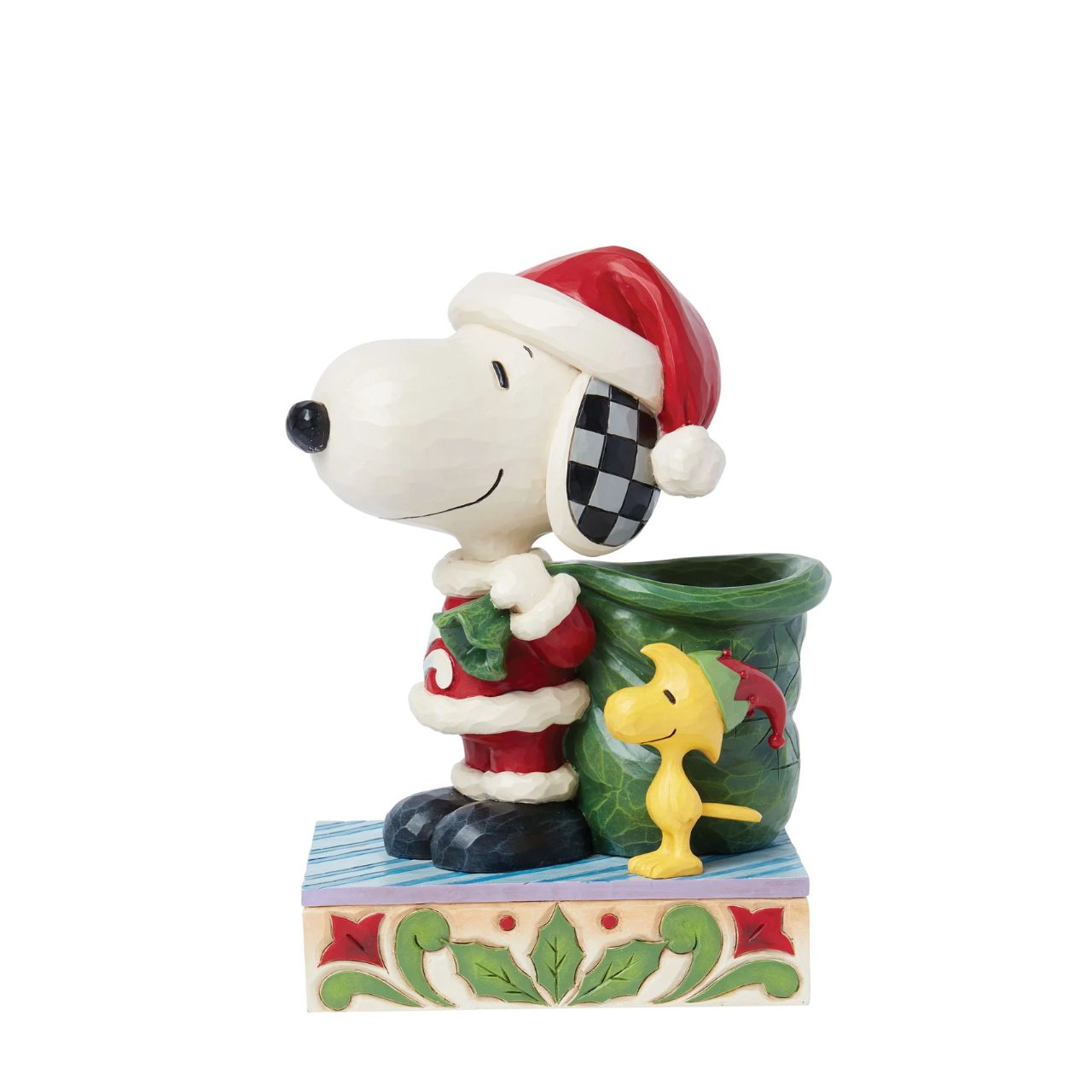 Dressed as Santa, Snoopy carries a sculpted bag deep enough to hold real candy canes! With Woodstock by his side, the patterned pair prepare for a holiday spent spreading joy and laughter. Celebrate the season with this Jim Shore Peanuts design.