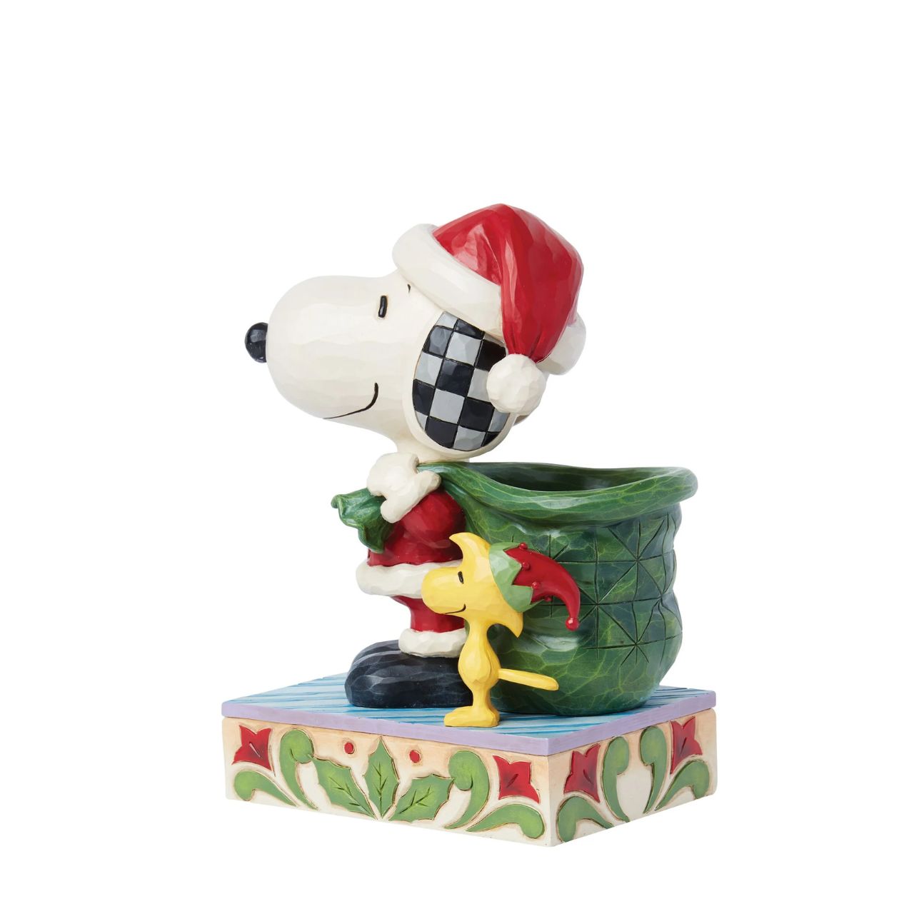 Dressed as Santa, Snoopy carries a sculpted bag deep enough to hold real candy canes! With Woodstock by his side, the patterned pair prepare for a holiday spent spreading joy and laughter. Celebrate the season with this Jim Shore Peanuts design.
