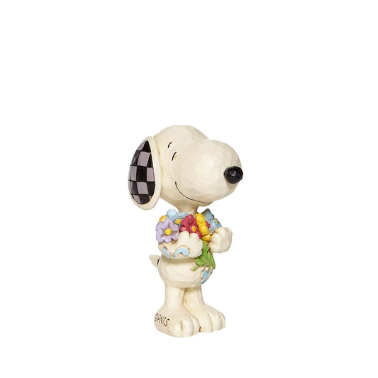 Treat yourself or someone special to Peanuts by Jim Shore collectable figurine. It's springtime and the world's most famous comic strip pup has picked some lovely flowers for you.