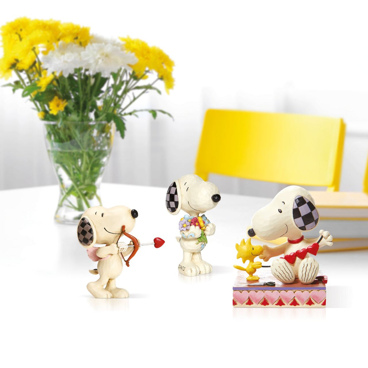 Treat yourself or someone special to Peanuts by Jim Shore collectable figurine. It's springtime and the world's most famous comic strip pup has picked some lovely flowers for you.