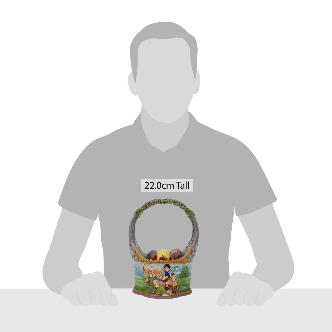 "The Tale That Started Them All " In honour of the 85th anniversary of Snow White and the Seven Dwarfs, Jim Shore crafts a dazzling Easter basket with 3 eggs showcasing the icons from the classic film in intricate detail and colour. The basket features two striking sides illustrating Snow White with her Prince and with her merry Seven Dwarfs.