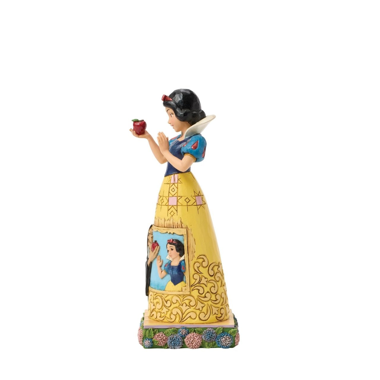 Snow White's story is told upon her gown in this sculpted scene from the creative mind of Jim Shore.
