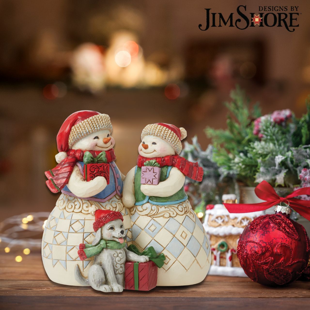 Heartwood Creek Christmas Collection Snowman Couple with Puppy Figurine  Designed by award winning artist Jim Shore as part of the Heartwood Creek Christmas Collection, hand crafted using high quality cast stone and hand painted, this Snowman couple with their cute puppy is perfect for the Christmas season. Packaging: Full colour, fully branded gift box with photo.