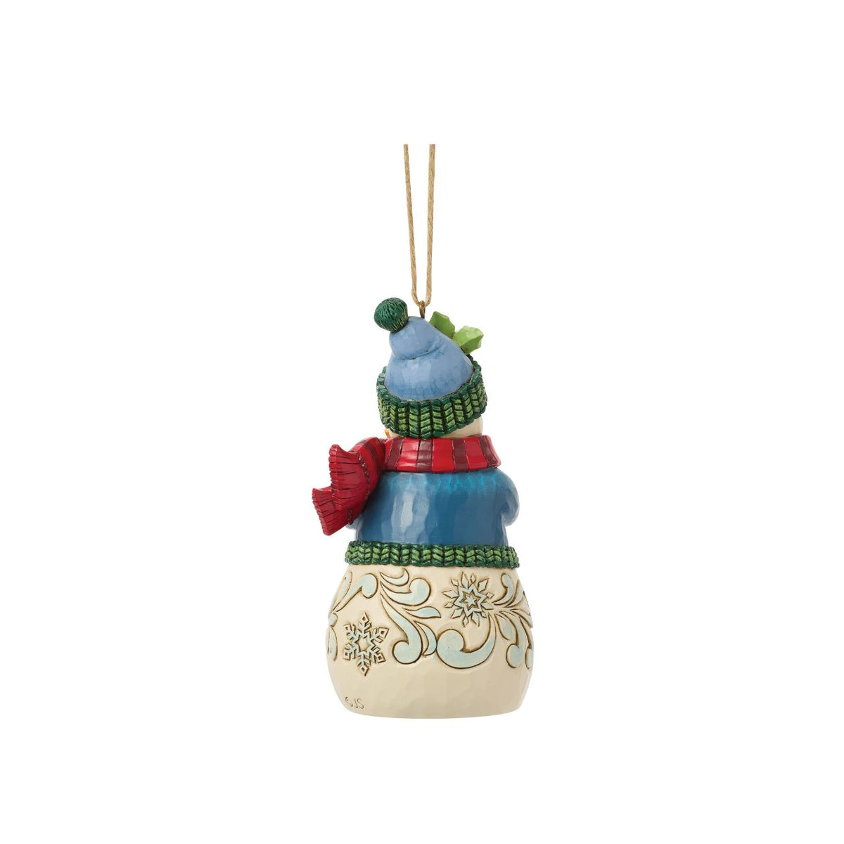 Celebrate the magic of Christmas with this delightful Snowman Figurine from Heartwood Creek by Jim Shore. This endearing snowman is depicted carrying an abundance of holiday treasures, showcasing Jim Shore's signature folk-art style with intricate patterns and a warm colour palette.