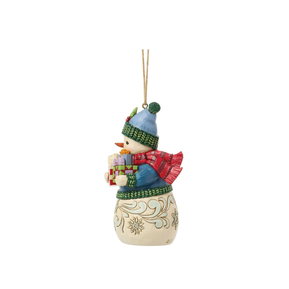 Celebrate the magic of Christmas with this delightful Snowman Figurine from Heartwood Creek by Jim Shore. This endearing snowman is depicted carrying an abundance of holiday treasures, showcasing Jim Shore's signature folk-art style with intricate patterns and a warm colour palette.