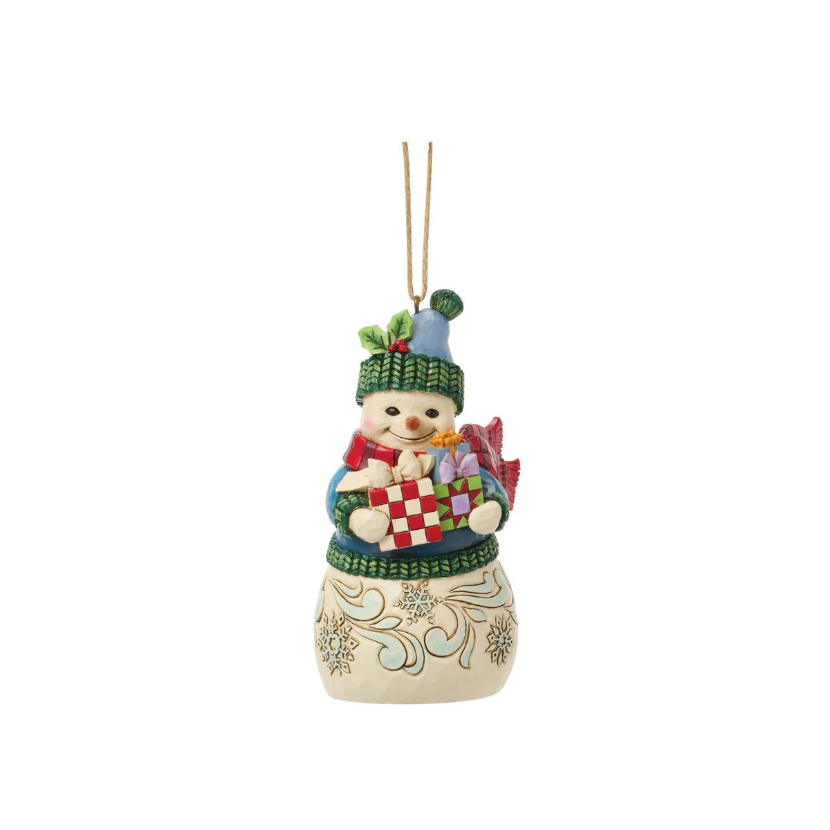 Celebrate the magic of Christmas with this delightful Snowman Figurine from Heartwood Creek by Jim Shore. This endearing snowman is depicted carrying an abundance of holiday treasures, showcasing Jim Shore's signature folk-art style with intricate patterns and a warm colour palette.