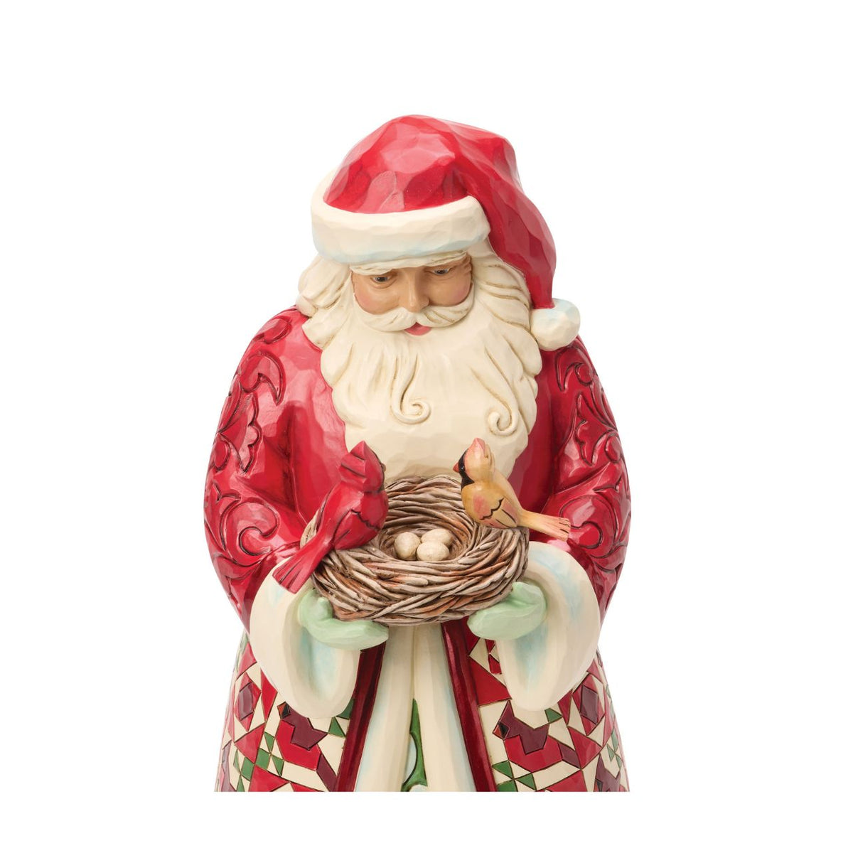 Celebrate the warmth of the season with this distinguished Collector's Edition Santa from Jim Shore's Heartwood Creek collection. Standing proudly with a nest of cardinals nestled in his arms, this beautifully crafted design reveals a charming surprise inside – delicate cardinal eggs waiting to be discovered.