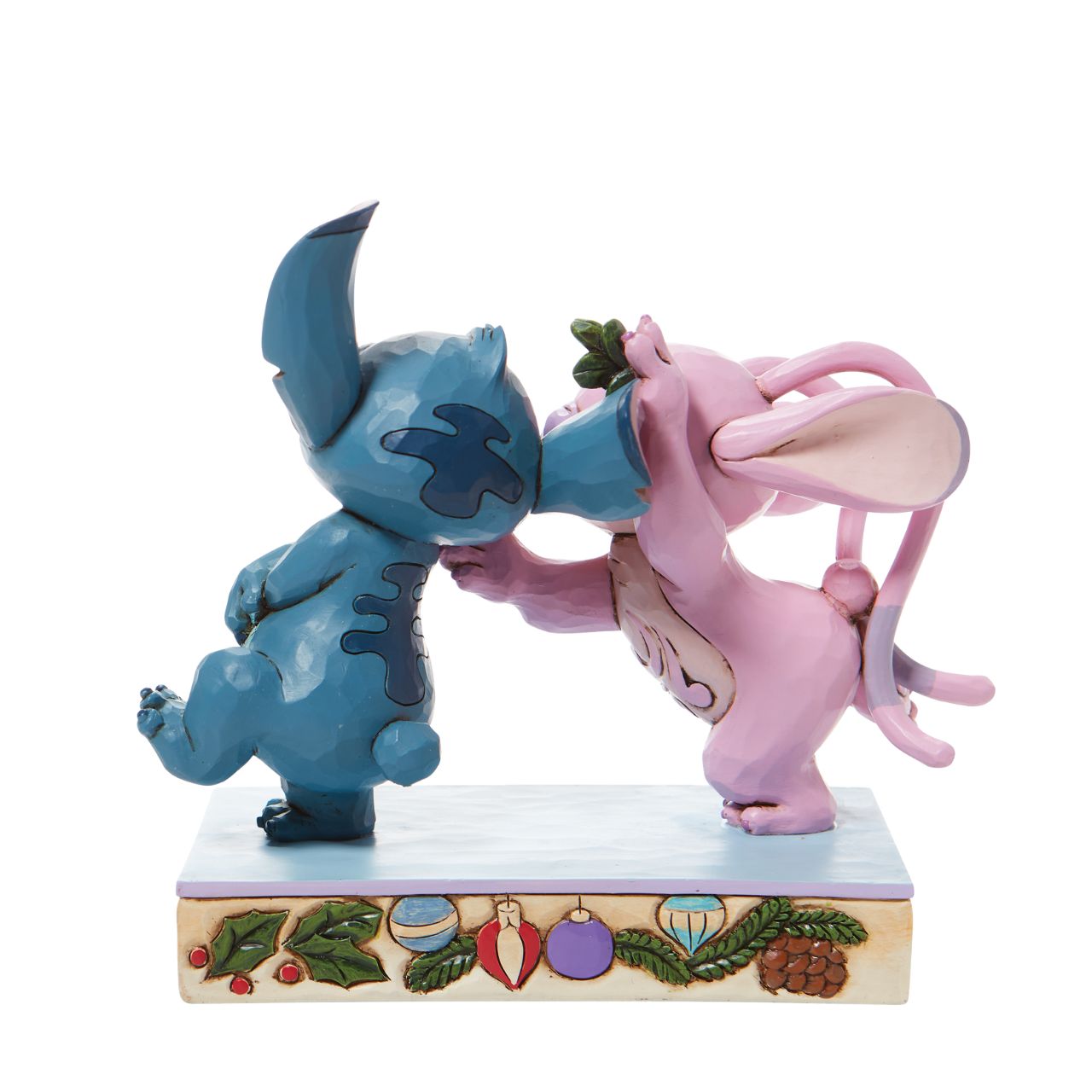 Disney Stitch and Angel with Mistletoe Figurine - Mistletoe Kiss  Stitch the holiday hooligan meets his match under the mistletoe this season. The pair of mischievous aliens share a smooch in this sweet Jim Shore figurine. Colourfully lined in ornaments, the pair make a lovely addition to any home - even on Earth.