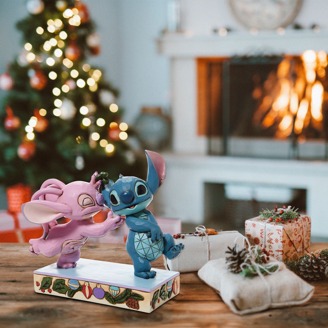 Disney Stitch and Angel with Mistletoe Figurine - Mistletoe Kiss  Stitch the holiday hooligan meets his match under the mistletoe this season. The pair of mischievous aliens share a smooch in this sweet Jim Shore figurine. Colourfully lined in ornaments, the pair make a lovely addition to any home - even on Earth.