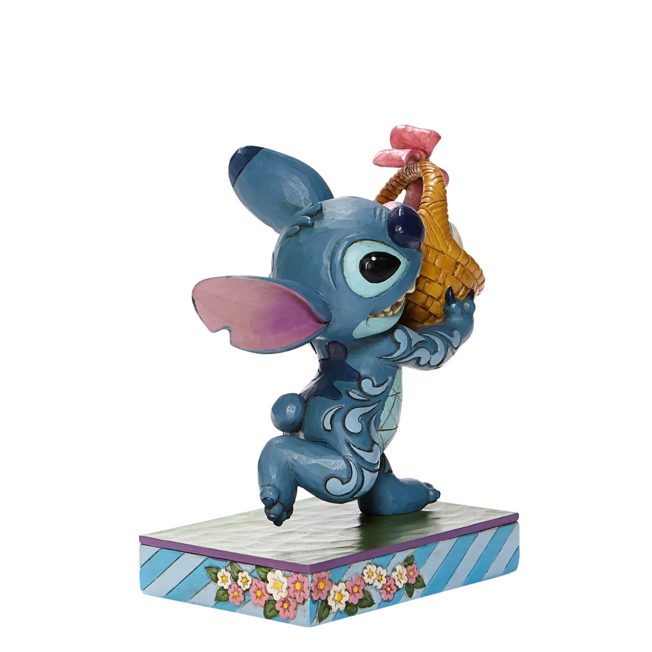 Jim Shore Bizarre Bunny - Stitch Running off with Easter Basket Figurine  Mischievous Stitch has taken off with your Easter basket so try and catch him if you can or entice him with his favourite, "Coconut Cake"| Designed by Jim Shore, this fun-loving Disney Traditions piece is hand-painted in cheery springtime hues.