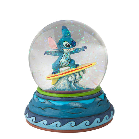 “Shootin’ the Curls” Stitch Snow Globe by Jim Shore  Stitch catches a wave inside your waterball! The Hawaiian adopted alien has learned a few things in his time on earth, among them playing the guitar and hanging ten. With striking form and colour, this Jim Shore design applauds the Disney film.