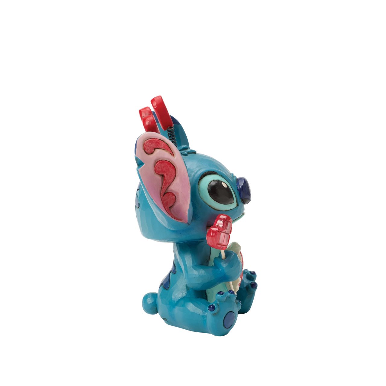 Stitch looks extra sweet in this Jim Shore creation, wearing a heart-topped headband and holding a heart-shaped lollipop.