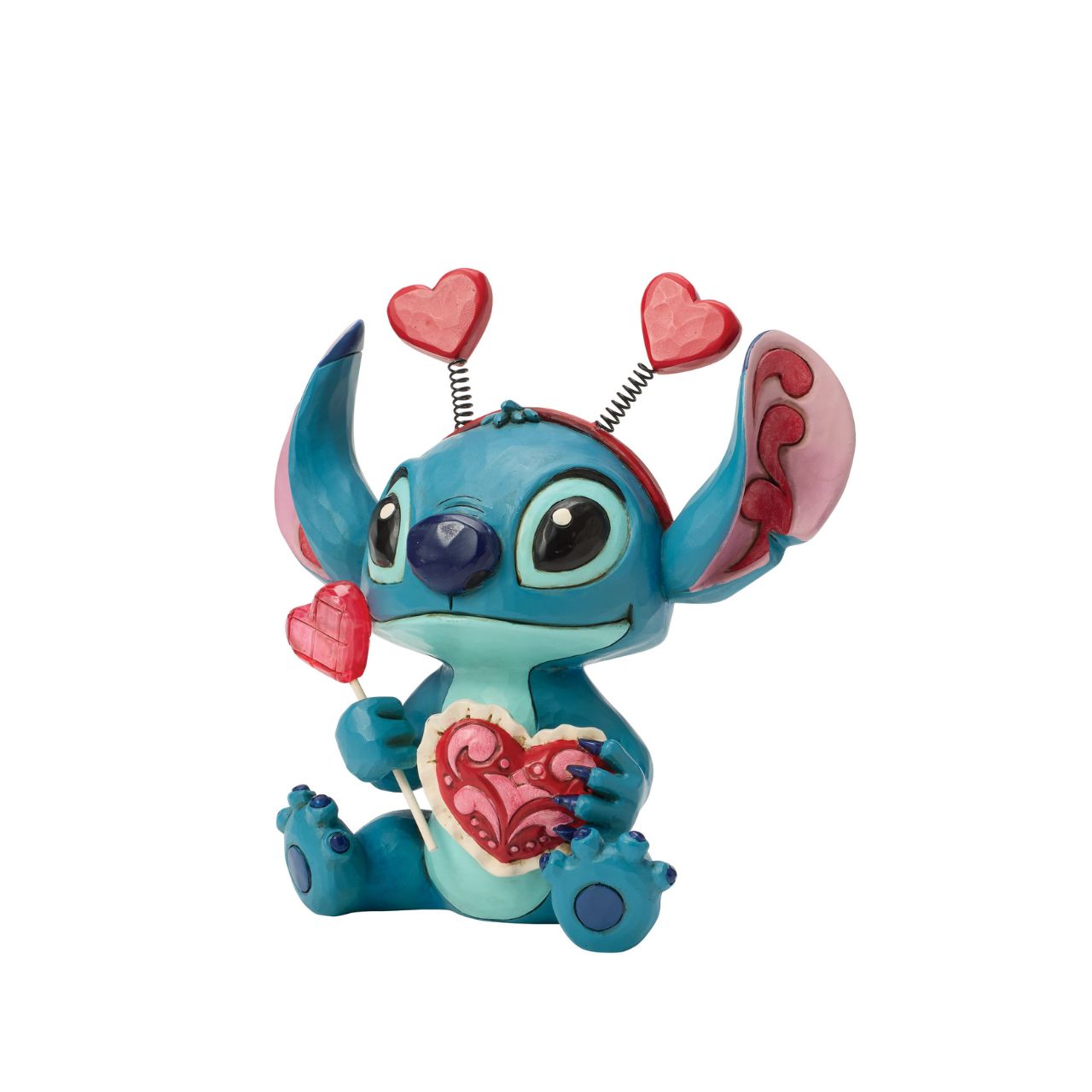Stitch looks extra sweet in this Jim Shore creation, wearing a heart-topped headband and holding a heart-shaped lollipop.