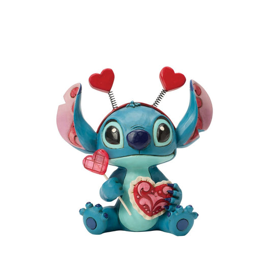 Stitch looks extra sweet in this Jim Shore creation, wearing a heart-topped headband and holding a heart-shaped lollipop.